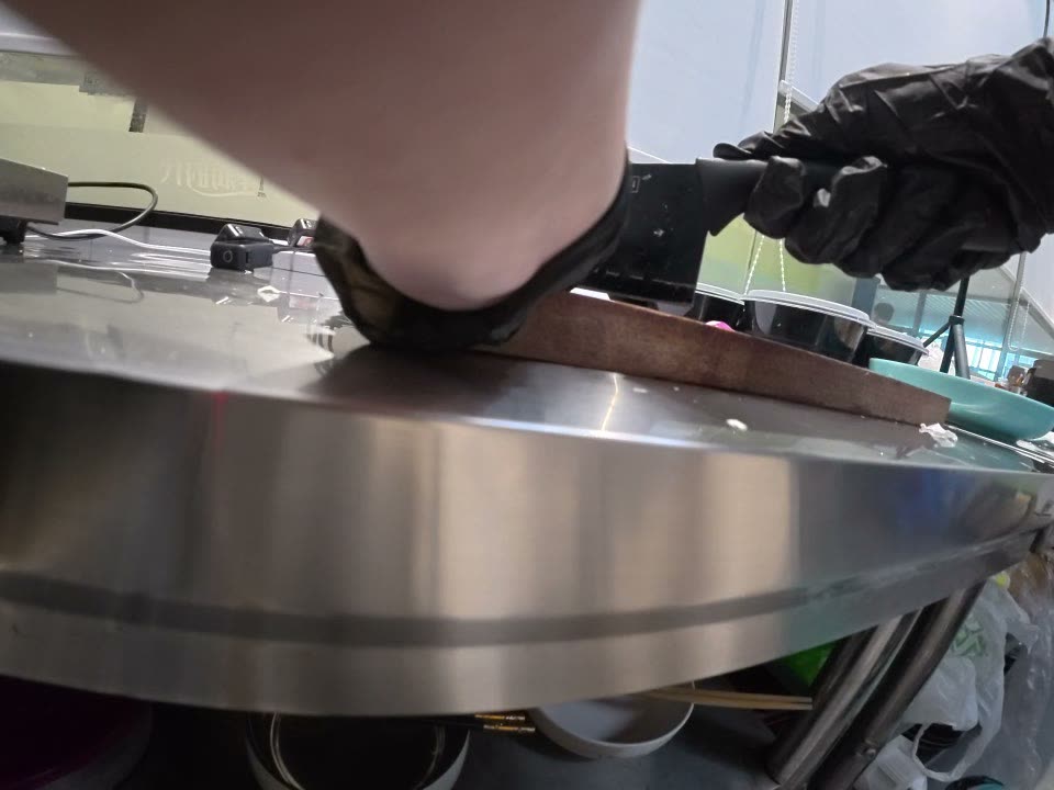 Wrist camera view of gloved hand holding knife