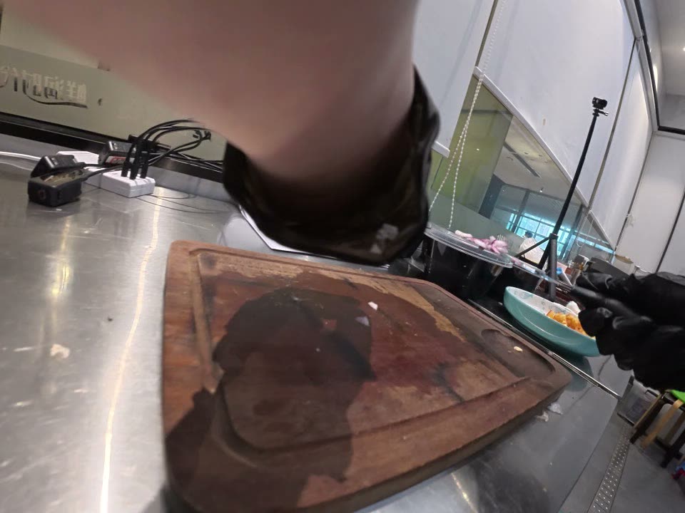 Wrist camera view of gloved hands